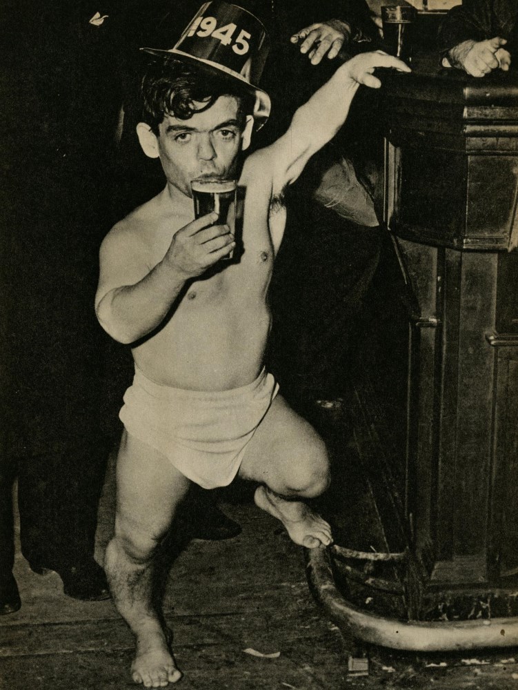 Lot #589: WEEGEE [arthur h. fellig] - Shorty, the Bowery Cherub, New Year's Eve - Original vintage photogravure