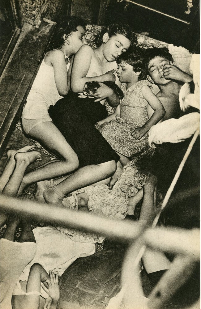Lot #102: WEEGEE [arthur h. fellig] - Children Sleeping on a Fire Escape - Original vintage photogravure