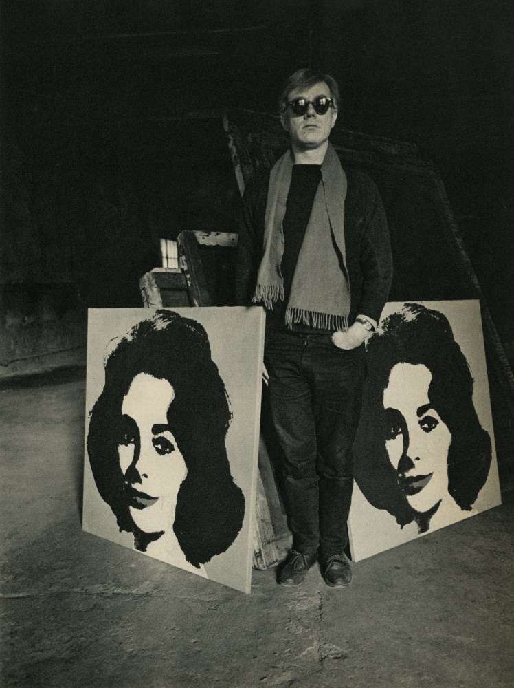 Lot #16: EVELYN HOFER - Andy Warhol with His Paintings of Liz Taylor - Original toned vintage photogravure