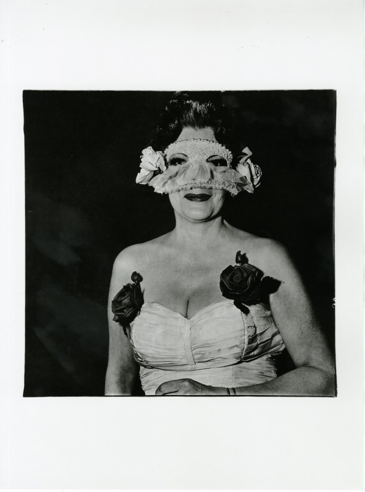 Lot #1095: DIANE ARBUS - Lady at a Masked Ball with Two Roses on Her Dress, N.Y.C - Original photogravure
