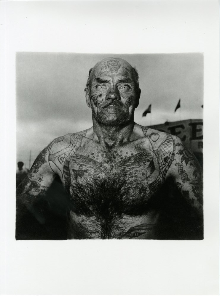 Lot #1388: DIANE ARBUS - Tattooed Man at a Carnival, Maryland - Original photogravure