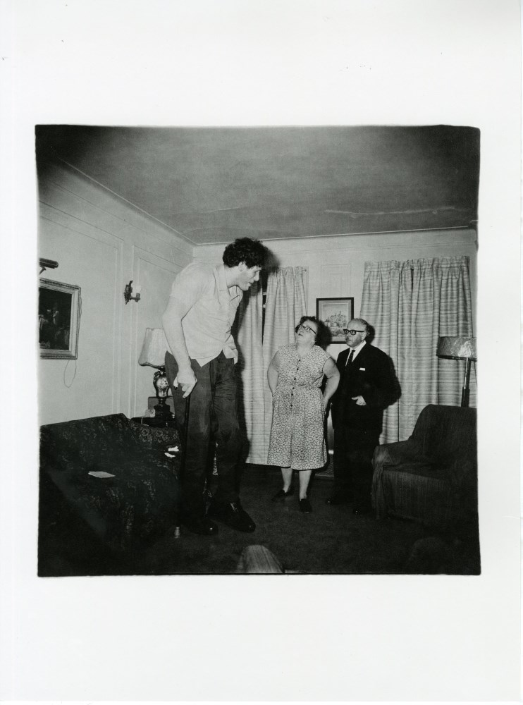 Lot #1067: DIANE ARBUS - Jewish Giant at Home with His Parents in the Bronx, New York - Original photogravure