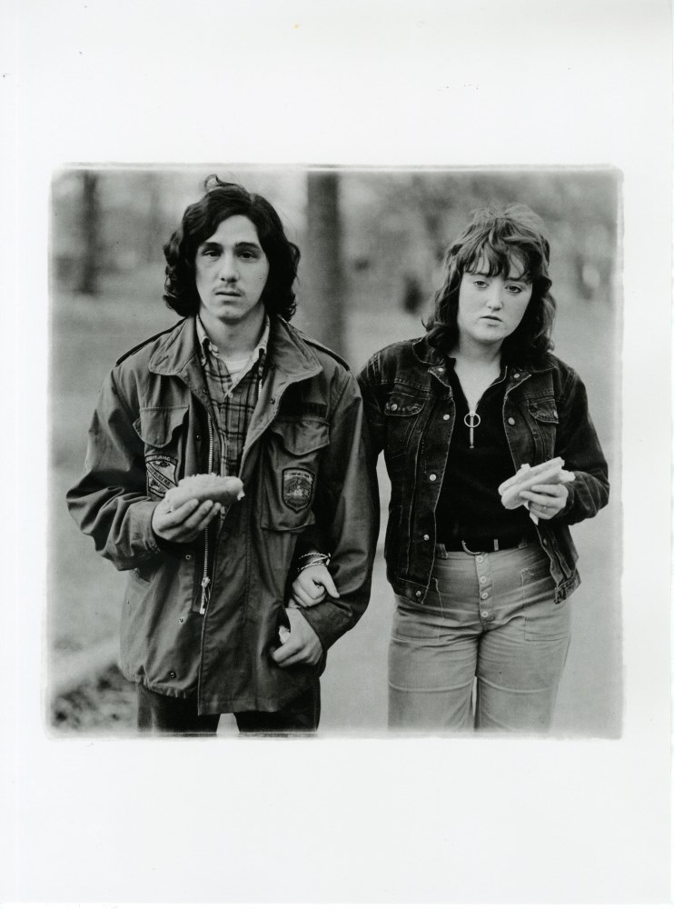 Lot #1670: DIANE ARBUS - A Young Man and His Girlfriend with Hot Dogs in the Park, N.Y.C - Original photogravure