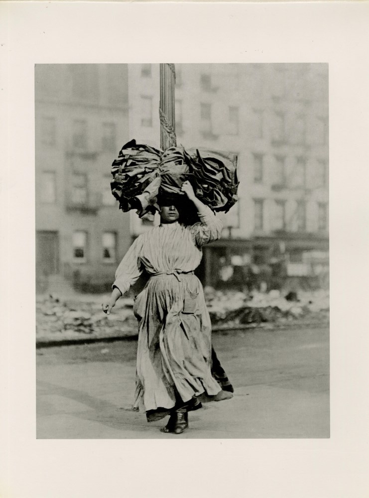 Lot #2326: LEWIS HINE - Italian Immigrant Woman Carrying Home Garments, Lower East Side, New York - Original photogravure