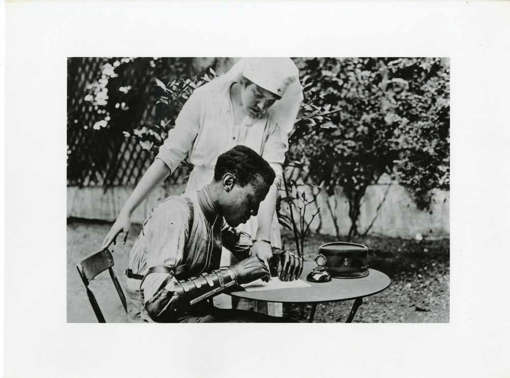 Lot #2821: LEWIS HINE - Red Cross Nurse and Man with Artificial Arm, France - Original photogravure