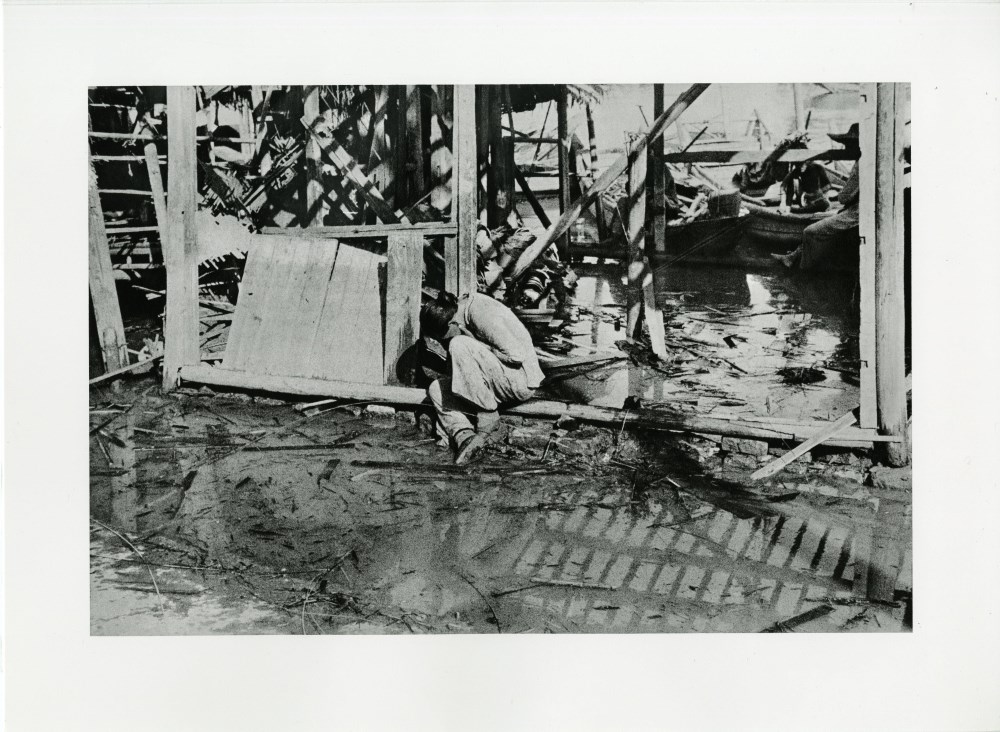 Lot #2215: ROBERT CAPA - Hankow, China: Aftermath of an Air Raid - Original photogravure