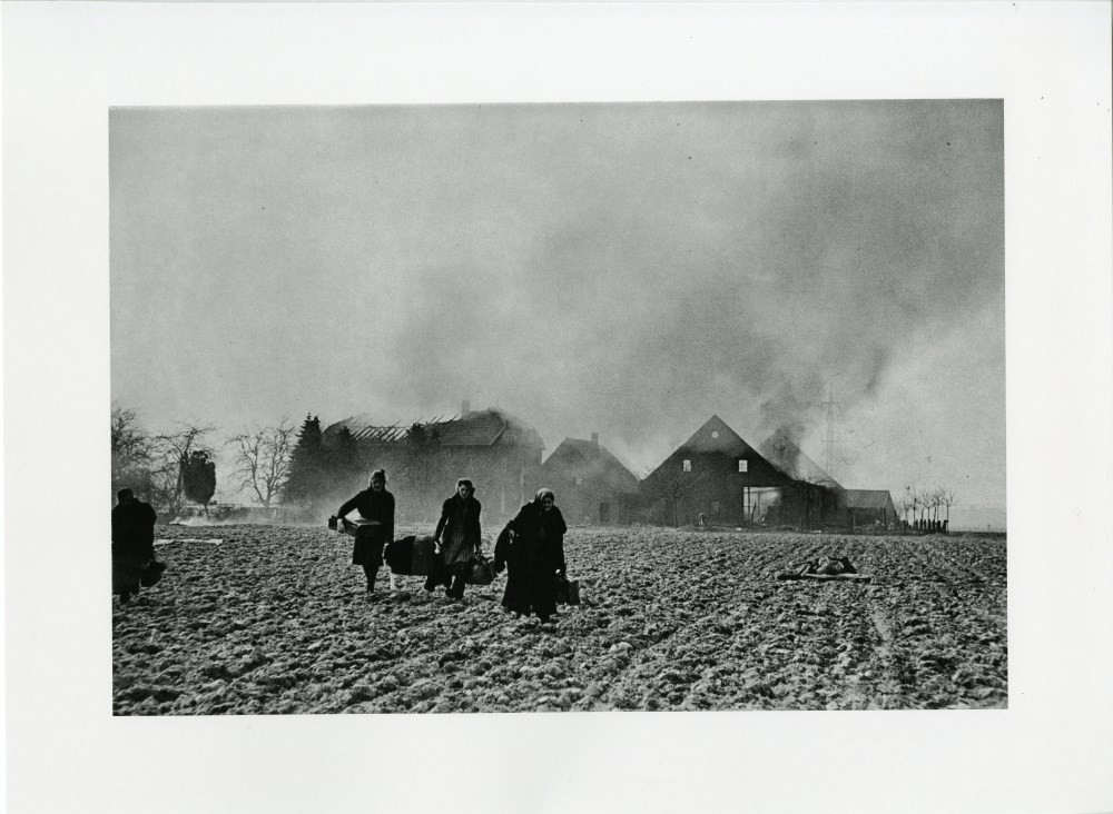 Lot #2160: ROBERT CAPA - Germany: German Civilians Leave Their Ruined Farmhouse - Original photogravure
