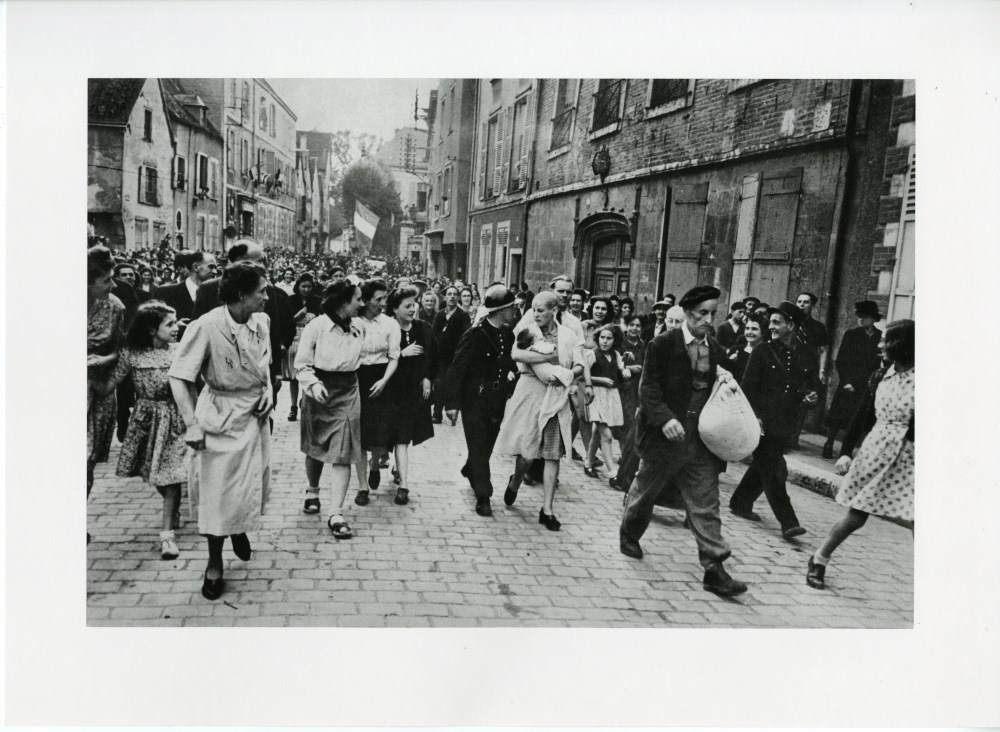 Lot #1866: ROBERT CAPA - Chartres, France: Woman Collaborator - Original photogravure