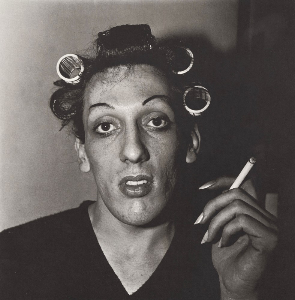 Lot #749: DIANE ARBUS - Young Man in Curlers at Home on West 20th Street, N.Y.C - Original vintage photogravure