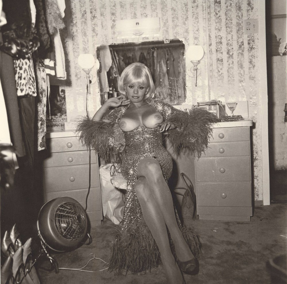 Lot #669: DIANE ARBUS - Topless Dancer in Her Dressing Room, San Francisco, CA - Original vintage photogravure
