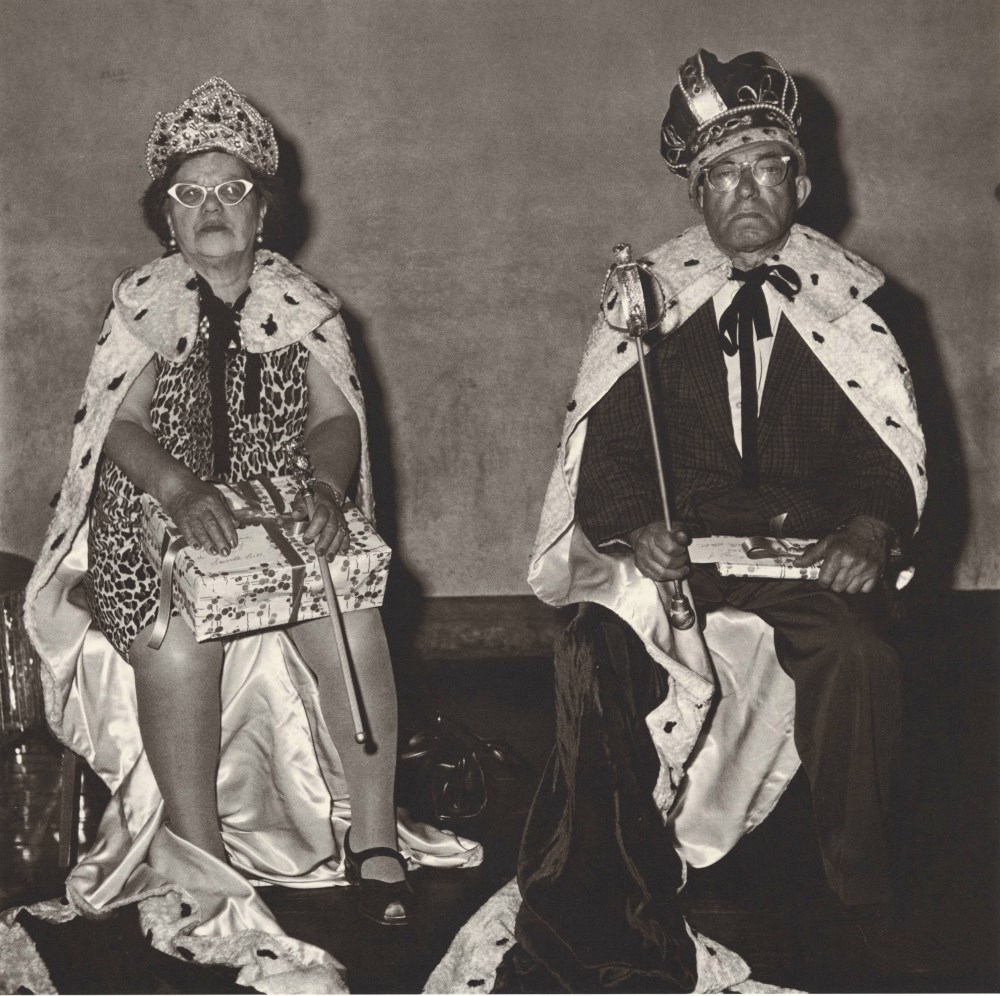 Lot #627: DIANE ARBUS - The King and Queen of a Senior Citizens Dance, N.Y.C - Original vintage photogravure