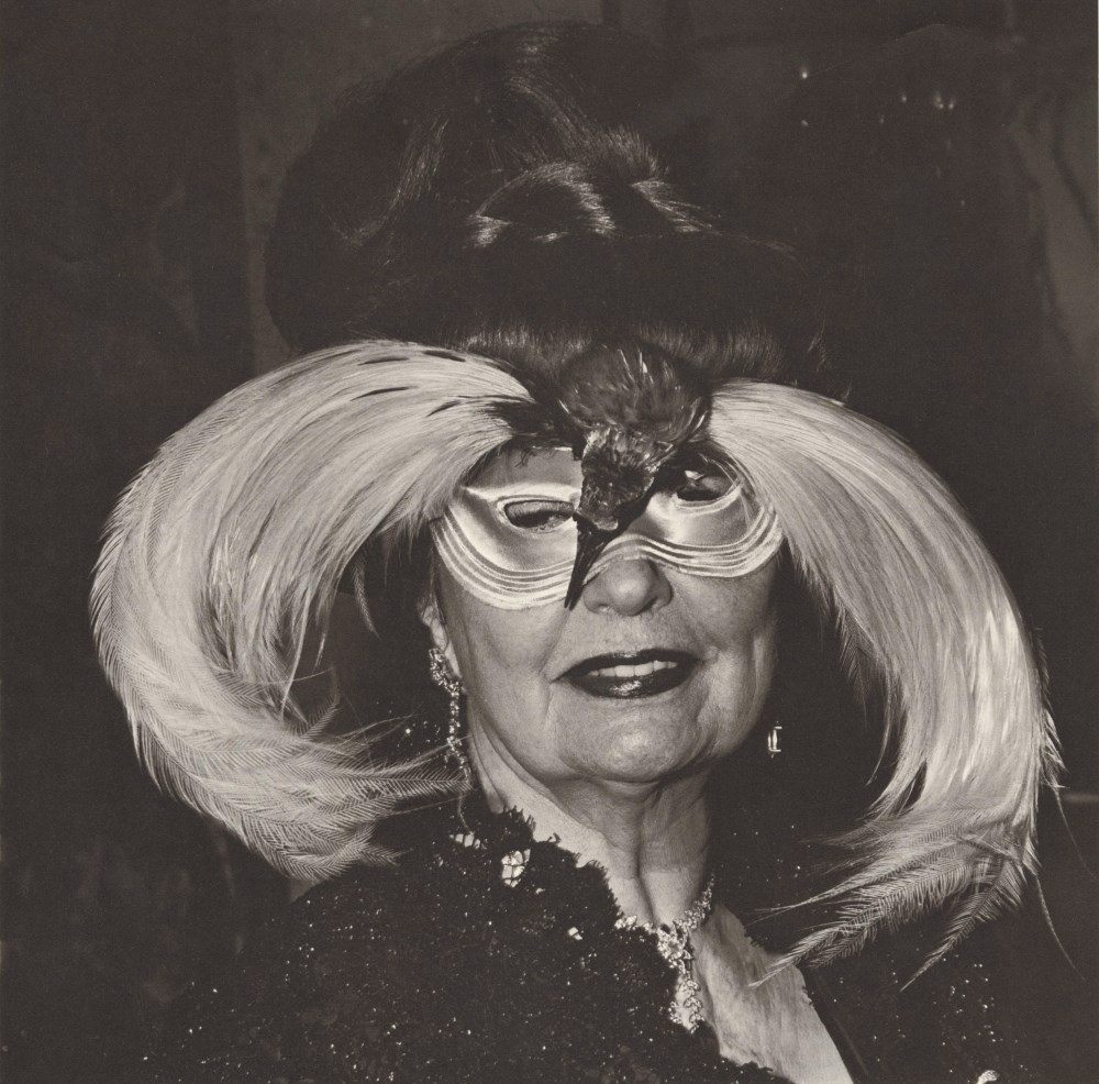 Lot #737: DIANE ARBUS - Woman in a Bird Mask, N.Y.C - Original vintage photogravure