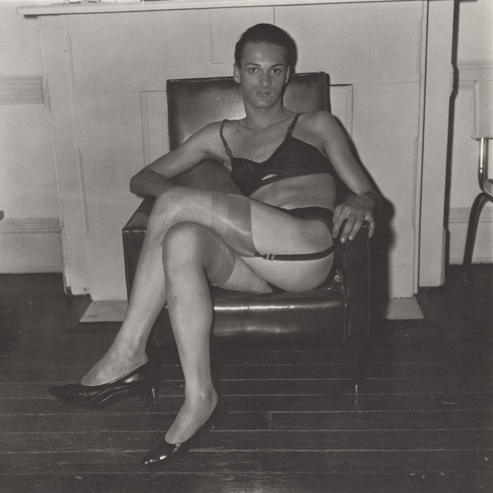 Lot #1344: DIANE ARBUS - Seated Man in Bra and Stockings, N.Y.C - Original vintage photogravure
