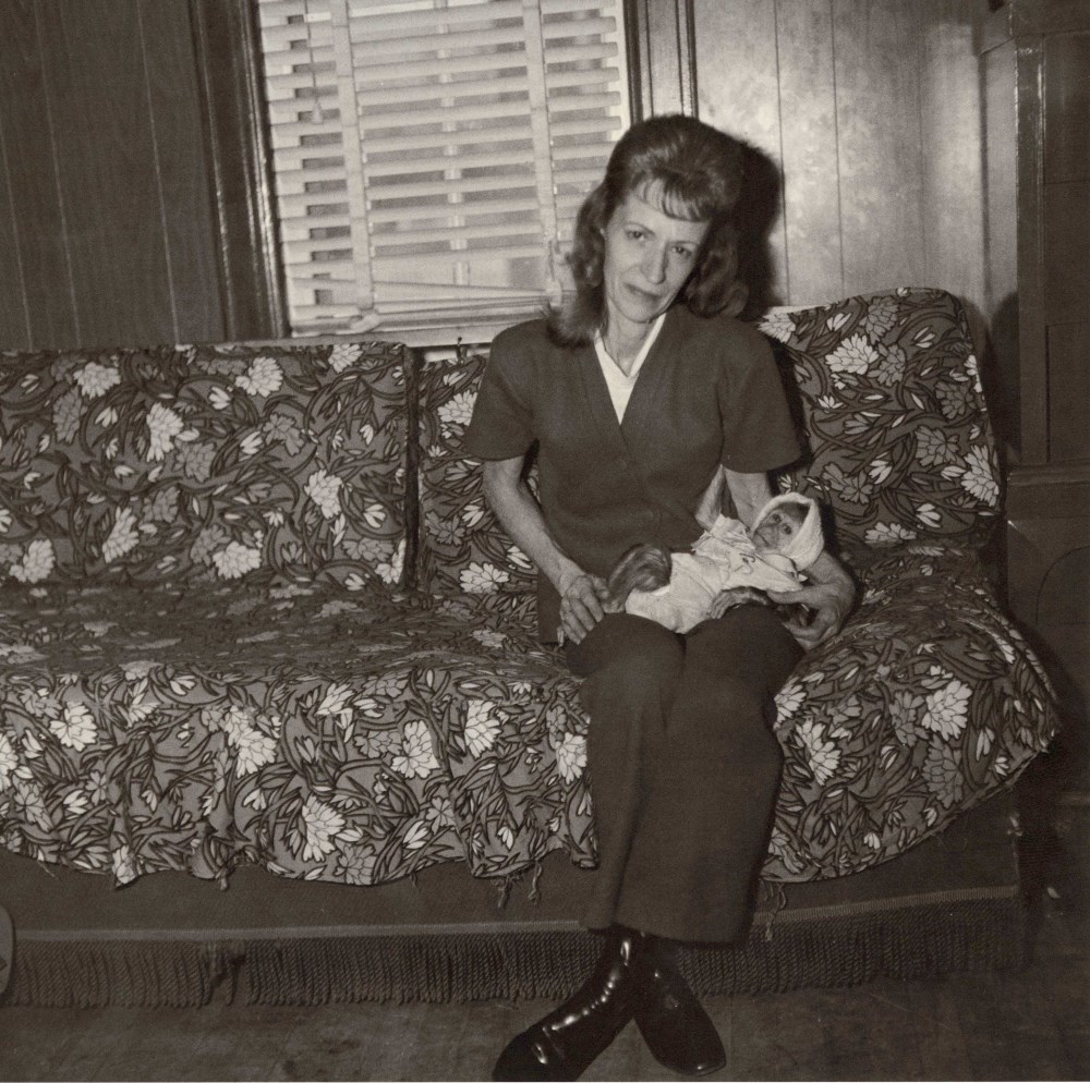 Lot #373: DIANE ARBUS - Mrs. Gladys 'Mitzi' Ulrich with Sam, a Baby Stump-tailed Macaque Monkey - Original vintage photogravure
