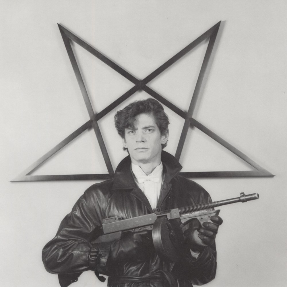 Lot #554: ROBERT MAPPLETHORPE - Self-portrait with Gun and Star - Original vintage photogravure