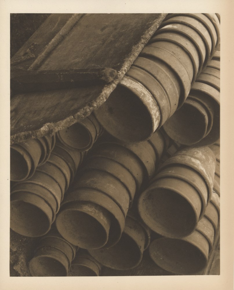 Lot #1491: EDWARD STEICHEN - Wheelbarrow with Flower Pots - Original warm-toned vintage photogravure