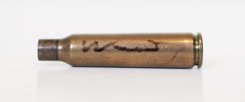 Lot #2471: ANDY WARHOL - Shell Casing - Brass shell casing (spent cartridge)